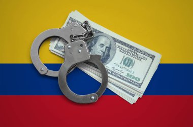 Kelepçe ile Kolombiya bayrak ve a bohça-in dolar. Ülkenin para birimi bozulması. Mali suçlar.