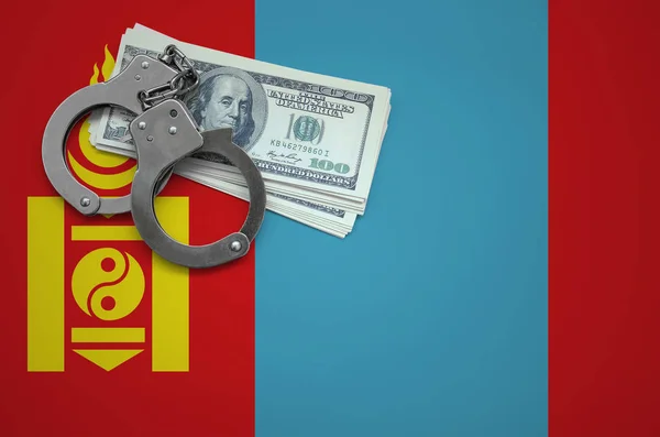 Mongolia flag  with handcuffs and a bundle of dollars. The concept of breaking the law and thieves crimes.