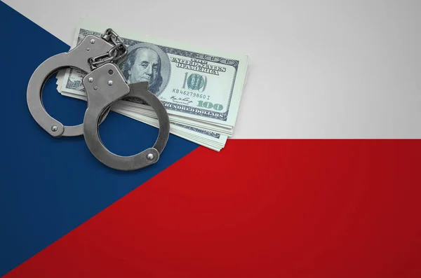 Czech flag  with handcuffs and a bundle of dollars. The concept of breaking the law and thieves crimes.