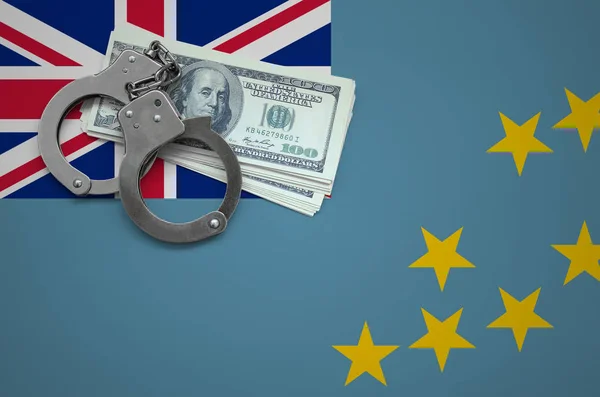 Tuvalu flag  with handcuffs and a bundle of dollars. The concept of breaking the law and thieves crimes.