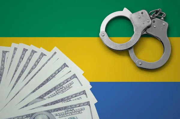 Gabon Bayrağı Ile Kelepçe Bohça Dolar Yasadışı Döviz Alım Işlemlerinde — Stok fotoğraf