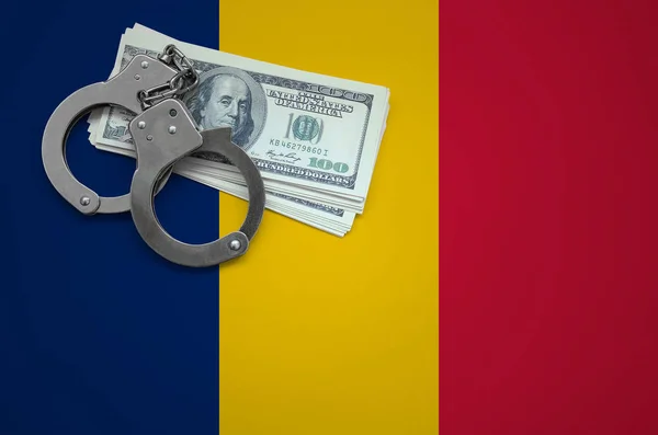 Chad flag  with handcuffs and a bundle of dollars. The concept of breaking the law and thieves crimes.