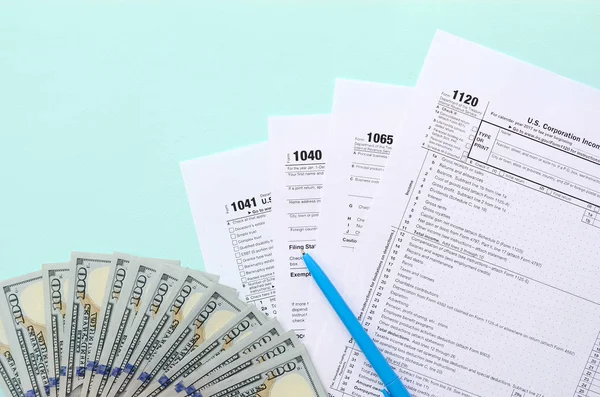 Tax Forms Lies Hundred Dollar Bills Blue Pen Light Blue — Stock Photo, Image