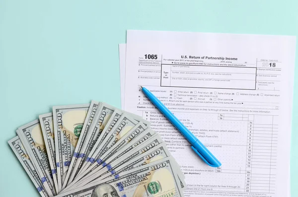 1065 Tax Form Lies Hundred Dollar Bills Blue Pen Light — Stock Photo, Image