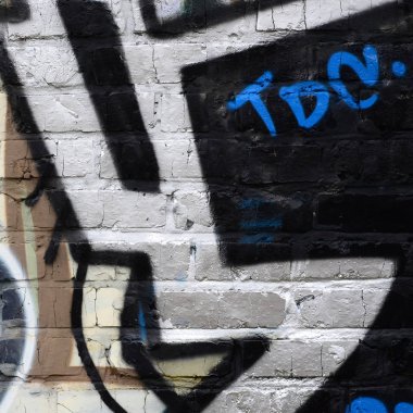 Grafiti çizimler parçası. Eski duvar boya lekeleri sokak sanatı kültür tarzı ile dekore edilmiştir. Renkli arka plan doku.