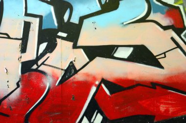 Grafiti çizimler parçası. Eski duvar boya lekeleri sokak sanatı kültür tarzı ile dekore edilmiştir. Renkli arka plan doku.