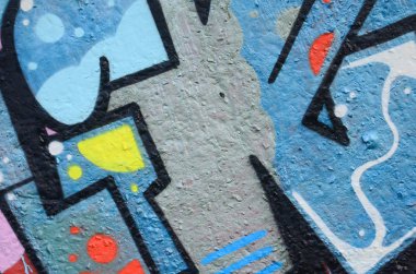 Grafiti çizimler parçası. Eski duvar boya lekeleri sokak sanatı kültür tarzı ile dekore edilmiştir. Renkli arka plan doku.