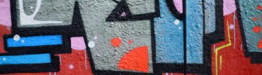 Grafiti çizimler parçası. Eski duvar boya lekeleri sokak sanatı kültür tarzı ile dekore edilmiştir. Renkli arka plan doku.