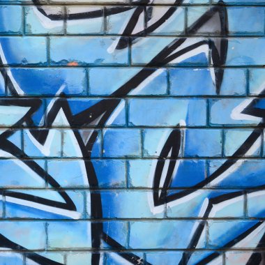 Grafiti çizimler parçası. Eski duvar boya lekeleri sokak sanatı kültür tarzı ile dekore edilmiştir. Renkli arka plan doku.