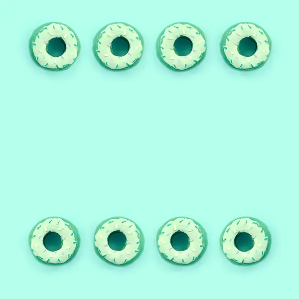 Muchos pequeños donuts de plástico se encuentra en un fondo de colores pastel. Piso establecer un patrón mínimo. Vista superior —  Fotos de Stock