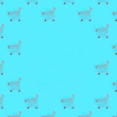 Alışveriş bağımlılığı, sevgilisi ya da Alışverişkoliğin kavramı alışveriş. Birçok küçük boş alışveriş sepetlerini bir desen bir pastel renkli kağıt arka plan üzerinde gerçekleştirin. Düz yatıyordu kompozisyon, üstten görünüm