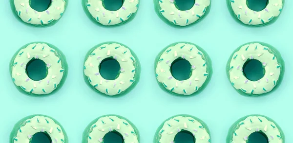 Birçok küçük plastik donuts bir pastel renkli arka plan üzerinde yatıyor. Düz yatıyordu en az desen. Üstten görünüm — Stok fotoğraf