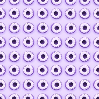 Birçok küçük plastik donuts bir pastel renkli arka plan üzerinde yatıyor. Düz yatıyordu en az desen. Üstten görünüm