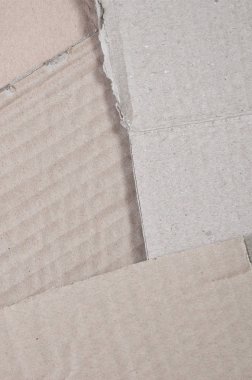 Bir sürü ev aletleri ve posta paketleri taşıma kutuları yapmak için kullanılan bej karton kağıt arka plan görüntüsü. Karton doku