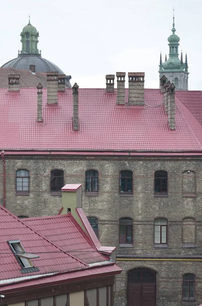 Fragment of a metal roof of the restored old multi-storey building in Lviv, Ukraine