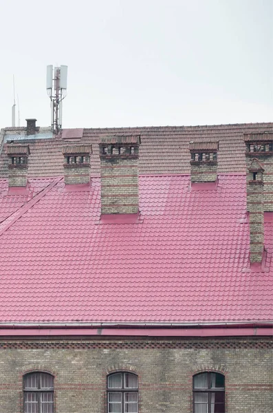 Fragment of a metal roof of the restored old multi-storey building in Lviv, Ukraine