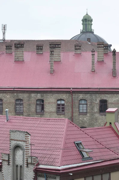 Fragment of a metal roof of the restored old multi-storey building in Lviv, Ukraine