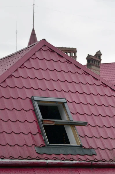 Fragment of a metal roof of the restored old multi-storey building in Lviv, Ukraine