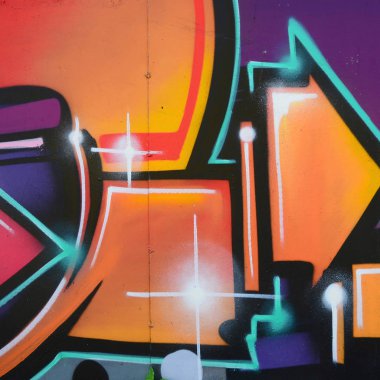 Grafiti çizimler parçası. Eski duvar boya lekeleri sokak sanatı kültür tarzı ile dekore edilmiştir. Renkli arka plan doku sıcak tonları içinde.