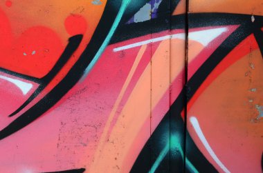 Grafiti çizimler parçası. Eski duvar boya lekeleri sokak sanatı kültür tarzı ile dekore edilmiştir. Renkli arka plan doku sıcak tonları içinde.