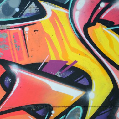 Grafiti çizimler parçası. Eski duvar boya lekeleri sokak sanatı kültür tarzı ile dekore edilmiştir. Renkli arka plan doku sıcak tonları içinde.