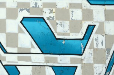 Grafiti çizimler parçası. Eski duvar boya lekeleri sokak sanatı kültür tarzı ile dekore edilmiştir. Renkli arka plan doku soğuk tonlarda.