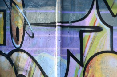 Grafiti çizimler parçası. Eski duvar boya lekeleri sokak sanatı kültür tarzı ile dekore edilmiştir. Çok renkli arka plan dokusu.