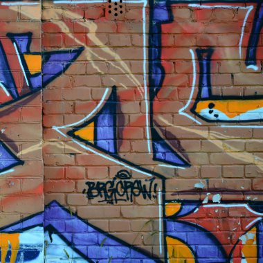 Grafiti çizimler parçası. Eski duvar boya lekeleri sokak sanatı kültür tarzı ile dekore edilmiştir. Renkli arka plan doku sıcak tonları içinde.