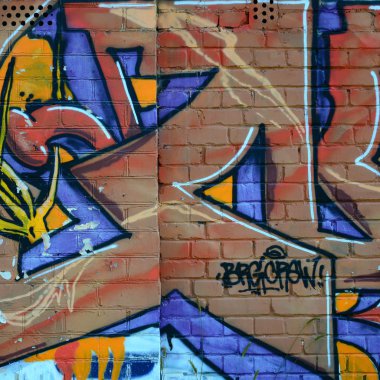 Grafiti çizimler parçası. Eski duvar boya lekeleri sokak sanatı kültür tarzı ile dekore edilmiştir. Renkli arka plan doku sıcak tonları içinde.