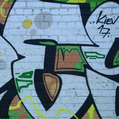 Grafiti çizimler parçası. Eski duvar boya lekeleri sokak sanatı kültür tarzı ile dekore edilmiştir. Yeşil tonlarında renkli arka plan doku.