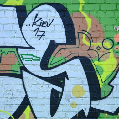 Grafiti çizimler parçası. Eski duvar boya lekeleri sokak sanatı kültür tarzı ile dekore edilmiştir. Yeşil tonlarında renkli arka plan doku.