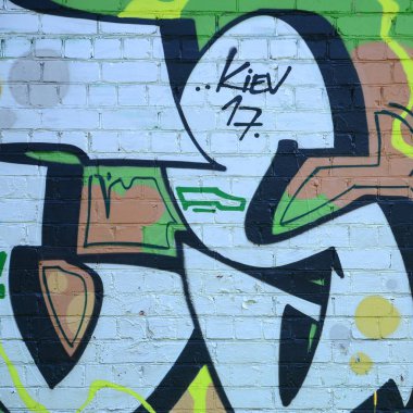 Grafiti çizimler parçası. Eski duvar boya lekeleri sokak sanatı kültür tarzı ile dekore edilmiştir. Yeşil tonlarında renkli arka plan doku.
