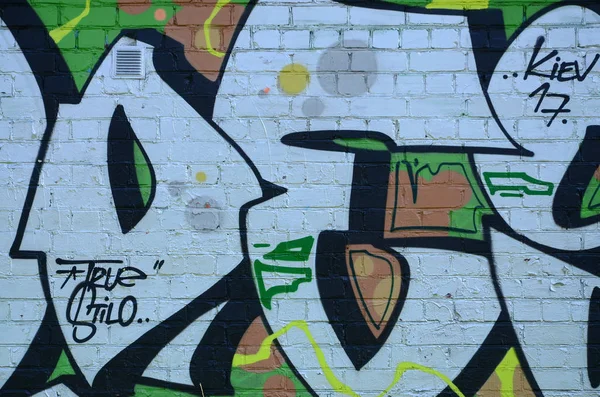 Grafiti çizimler parçası. Eski duvar boya lekeleri sokak sanatı kültür tarzı ile dekore edilmiştir. Yeşil tonlarında renkli arka plan doku.