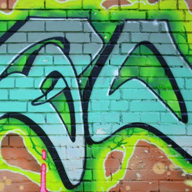Grafiti çizimler parçası. Eski duvar boya lekeleri sokak sanatı kültür tarzı ile dekore edilmiştir. Yeşil tonlarında renkli arka plan doku.