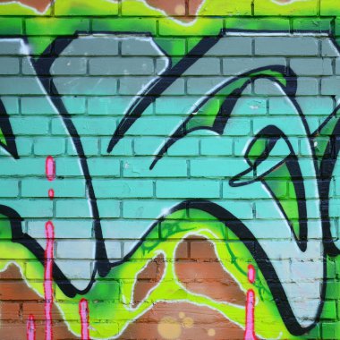 Grafiti çizimler parçası. Eski duvar boya lekeleri sokak sanatı kültür tarzı ile dekore edilmiştir. Yeşil tonlarında renkli arka plan doku.