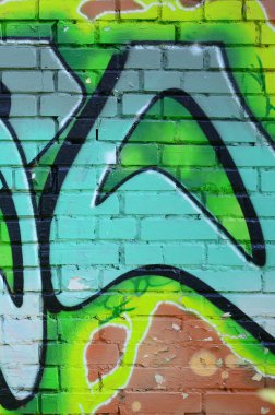 Grafiti çizimler parçası. Eski duvar boya lekeleri sokak sanatı kültür tarzı ile dekore edilmiştir. Yeşil tonlarında renkli arka plan doku.