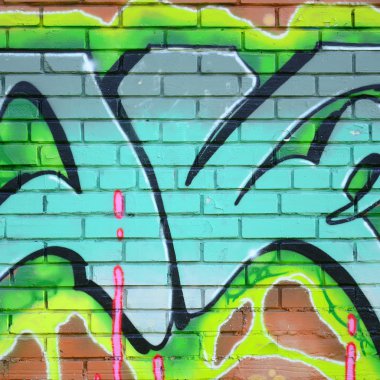 Grafiti çizimler parçası. Eski duvar boya lekeleri sokak sanatı kültür tarzı ile dekore edilmiştir. Yeşil tonlarında renkli arka plan doku.