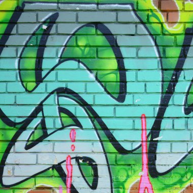 Grafiti çizimler parçası. Eski duvar boya lekeleri sokak sanatı kültür tarzı ile dekore edilmiştir. Yeşil tonlarında renkli arka plan doku.