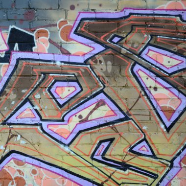 Grafiti çizimler parçası. Eski duvar boya lekeleri sokak sanatı kültür tarzı ile dekore edilmiştir. Renkli arka plan doku sıcak tonları içinde.