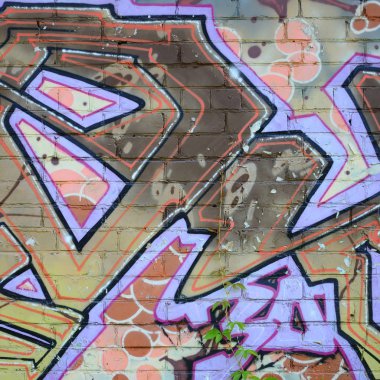 Grafiti çizimler parçası. Eski duvar boya lekeleri sokak sanatı kültür tarzı ile dekore edilmiştir. Renkli arka plan doku sıcak tonları içinde.