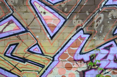 Grafiti çizimler parçası. Eski duvar boya lekeleri sokak sanatı kültür tarzı ile dekore edilmiştir. Renkli arka plan doku sıcak tonları içinde.