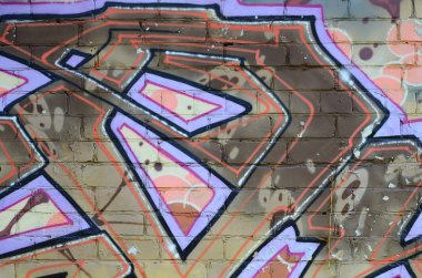 Grafiti çizimler parçası. Eski duvar boya lekeleri sokak sanatı kültür tarzı ile dekore edilmiştir. Renkli arka plan doku sıcak tonları içinde.