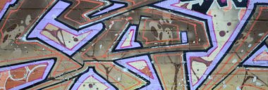 Grafiti çizimler parçası. Eski duvar boya lekeleri sokak sanatı kültür tarzı ile dekore edilmiştir. Renkli arka plan doku sıcak tonları içinde.