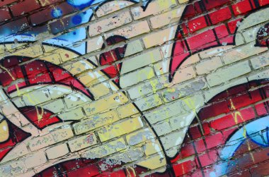 Grafiti çizimler parçası. Eski duvar boya lekeleri sokak sanatı kültür tarzı ile dekore edilmiştir. Renkli arka plan doku sıcak tonları içinde.