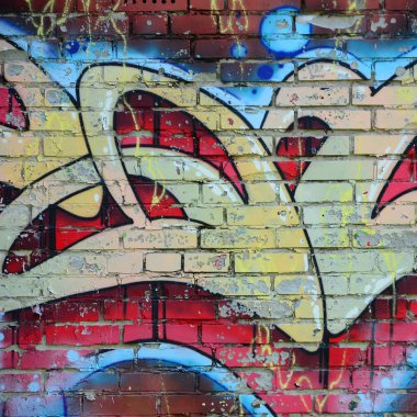 Grafiti çizimler parçası. Eski duvar boya lekeleri sokak sanatı kültür tarzı ile dekore edilmiştir. Renkli arka plan doku sıcak tonları içinde.