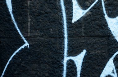 Grafiti çizimler parçası. Eski duvar boya lekeleri sokak sanatı kültür tarzı ile dekore edilmiştir. Renkli arka plan doku.