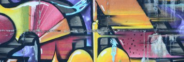 Grafiti çizimler parçası. Eski duvar boya lekeleri sokak sanatı kültür tarzı ile dekore edilmiştir. Renkli arka plan doku sıcak tonları içinde.