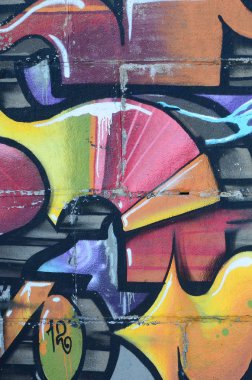 Grafiti çizimler parçası. Eski duvar boya lekeleri sokak sanatı kültür tarzı ile dekore edilmiştir. Renkli arka plan doku sıcak tonları içinde.