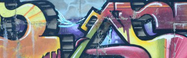 Grafiti çizimler parçası. Eski duvar boya lekeleri sokak sanatı kültür tarzı ile dekore edilmiştir. Renkli arka plan doku sıcak tonları içinde.