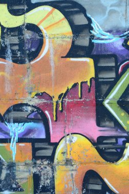 Grafiti çizimler parçası. Eski duvar boya lekeleri sokak sanatı kültür tarzı ile dekore edilmiştir. Renkli arka plan doku sıcak tonları içinde.